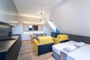 TV a/nebo společenská místnost v ubytování Apartmány R31