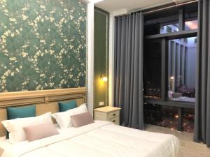Φωτογραφία από το άλμπουμ του April Fair Duplex Apartment Guangzhou South Railway Station Ao Yuan Yue Shi Dai Branch στο Γκουανγκζού