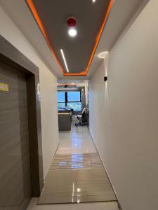 an office hallway with a red light on the ceiling at hotel r k VILLA in Ahmedabad
