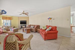 a living room with couches and chairs and a tv at Highlander - Quiet vacation comfort! in Deep Hole