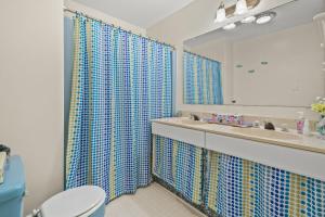 a bathroom with a sink and a toilet and a mirror at Highlander - Quiet vacation comfort! in Deep Hole +26 photos