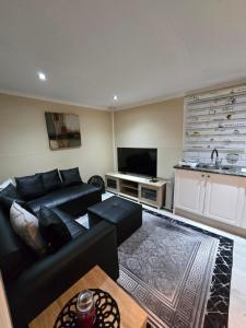 TV a/nebo společenská místnost v ubytování Cozy Cabin + 37 fotografií