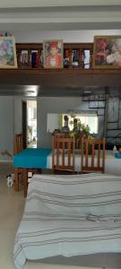 a bedroom with a bed and a table with chairs at Shalon in Marituba