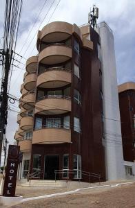 a tall brick building with a spiral at Nordeste Palace Hotel - Glória-SE in Nossa Senhora da Glória