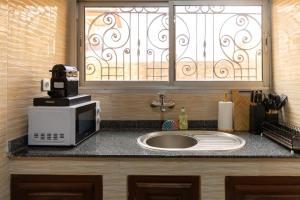 Η κουζίνα ή μικρή κουζίνα στο High-end 2BR apartment in the heart of Yaoundé