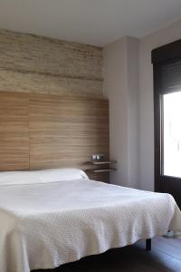 Postel nebo postele na pokoji v ubytování Apartamentos Reyes Catolicos 14