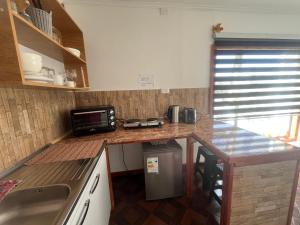 Kuchyň nebo kuchyňský kout v ubytování LOFT Glaciar Serrano