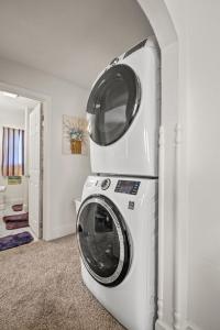 a white washer and dryer in a room at Lazy Days - Pet friendly with screened gazebo! in Deep Hole