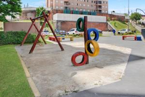 a group of playground equipment in a park at Pool 1 Suite 2 Bedrooms Modern Balcony in Carapicuíba