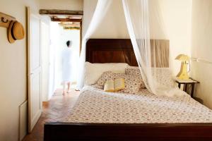 Postel nebo postele na pokoji v ubytování Casa Il Sàrperi In Montecatini Val Di Cecina