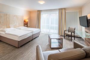 Letto o letti in una camera di Balland's Hotel & Restaurant