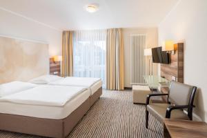 Letto o letti in una camera di Balland's Hotel & Restaurant