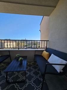 a balcony with a blue couch and a table at LaNiMa LUX in Žminj