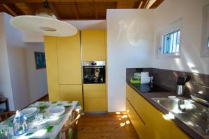 a kitchen with a sink and a counter top at Domus Villa Viola in Albiolo vicino al lago di Como in Albiolo