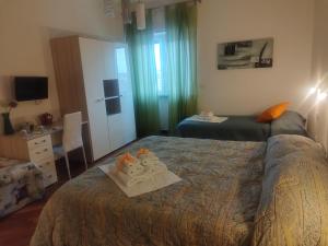Posteľ alebo postele v izbe v ubytovaní Residenza Piazza Moro
