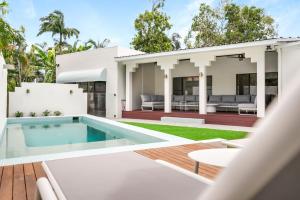 an image of a house with a swimming pool at Casa Del Sol Palm Cove in Palm Cove