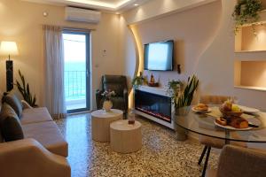 Μια τηλεόραση ή/και κέντρο ψυχαγωγίας στο Sykea Luxury Apartment +64 φωτογραφίες