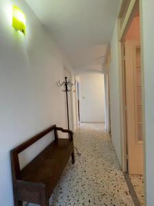 een kamer met een bed en een lampje aan de muur bij Casa Nunziada in Patrimonio Garden level, Quiet and Bright in Patrimonio