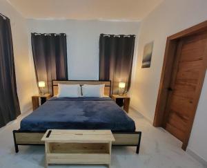 Ένα ή περισσότερα κρεβάτια σε δωμάτιο στο Villa Tranquila - Sosua Ocean Village +34 φωτογραφίες
