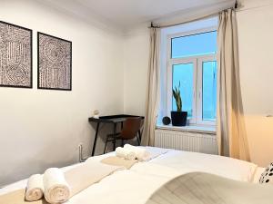 Postel nebo postele na pokoji v ubytování Stylish Central Apartment