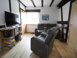 Televiisor ja/või meelelahutuskeskus majutusasutuses Ferienwohnung in der hübschen Inselstadt Malchow +6 fotot