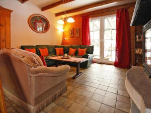 a living room with a couch and a table at Ferienhaus in Wieda mit Garten in Wieda
