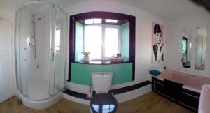 a bathroom with a shower and a toilet and a tub at Hill House in Banbury