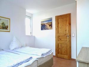 Ένα ή περισσότερα κρεβάτια σε δωμάτιο στο Wohnung in Lütow nahe Ostseestrand