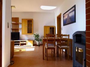 a kitchen and dining room with a table and chairs at Apartment for up to 7 people in Lepels Hof in Lütow