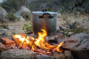 a pot sitting on top of a camp fire at Monoshez Bush Camp in Nsikazi