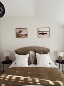 a bedroom with a large bed with two side tables at The Potting Shed in Chepstow