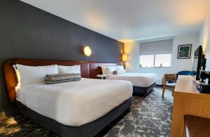 Postel nebo postele na pokoji v ubytování Rayland Hotel