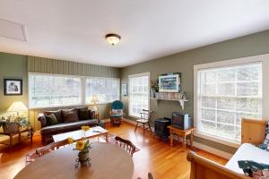 a living room with a couch and a table at Molalla River Cottage in Molalla