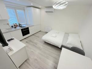 Postel nebo postele na pokoji v ubytování Krásny byt - apartmán v Novom meste