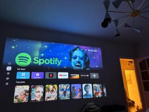 a flat screen tv hanging on a wall at AUKŠTAS Ap in Visaginas