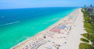 an overhead view of a beach with umbrellas and the ocean at Oceanfront Private Condo at The Setai -2707 in Miami Beach