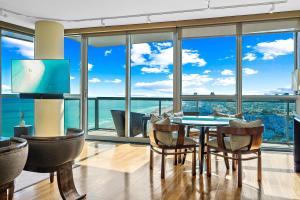 a dining room with a view of the ocean at Oceanview Private Condo at The Setai -3504 in Miami Beach