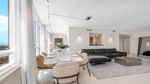a living room with a table and a couch at Oceanview Private Condo at The Setai -2102 in Miami Beach