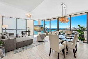 a living room with a dining table and a couch at Oceanview Private Condo at The Setai -2604 in Miami Beach