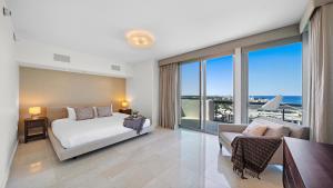 a bedroom with a bed and a view of the ocean at Oceanview Private Penthouse Condo at The Setai -3903 in Miami Beach