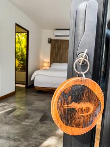 A bed or beds in a room at The Bohemian Lagarto