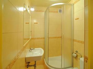 a bathroom with a shower and a sink at holiday home with thatched roof, Rekowo in Rekowo