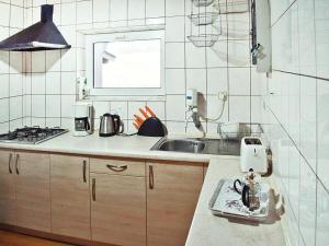a kitchen with a sink and a counter top at holiday home with thatched roof, Rekowo in Rekowo +34 photos