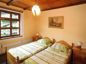 a bedroom with a bed and a window at holiday home with thatched roof, Rekowo in Rekowo