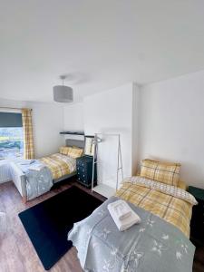 Voodi või voodid majutusasutuse The Follonsby Foal Hot Tub Retreat toas