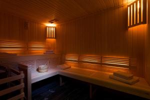 a sauna with a bench with towels on it at Hotel Atmospheres in Paris