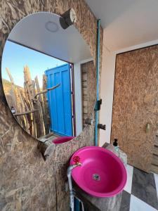a bathroom with a pink sink in front of a mirror at Mojarra Beach-Wind Room- Santa Veronica in Salina de Rey +33 photos