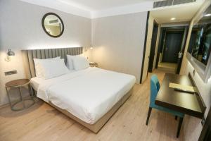 Postel nebo postele na pokoji v ubytování Milord Hotel
