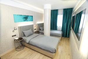 Postel nebo postele na pokoji v ubytování Milord Hotel