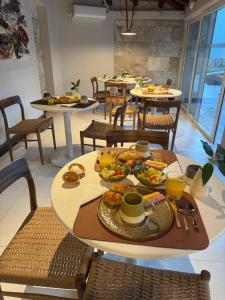 a table with food on it in a restaurant at Casa Haydee in Ciudad Lujan de Cuyo